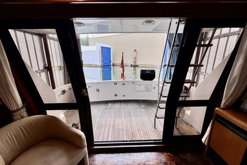  Yacht Photos Pics Interior view of 1998 Ocean Alexander 420 yacht with open doors to deck.