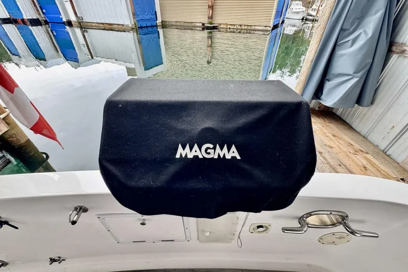  Yacht Photos Pics Covered Magma grill on 1998 Ocean Alexander 420 yacht, docked near water.