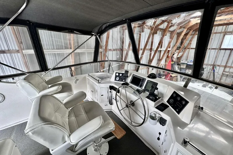  Yacht Photos Pics Interior view of 1998 Ocean Alexander 420 yacht helm with modern navigation equipment.