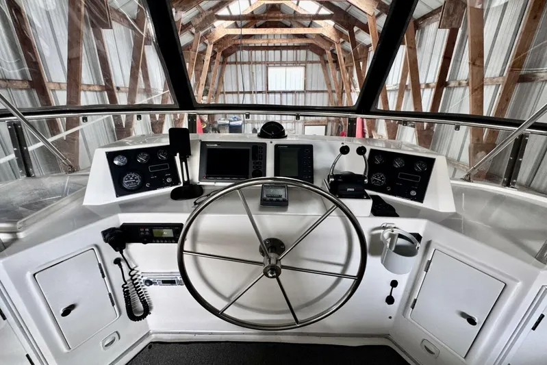  Yacht Photos Pics Cockpit of 1998 Ocean Alexander 420 yacht with steering wheel and navigation instruments.