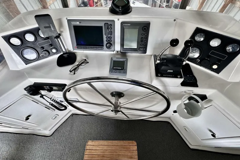  Yacht Photos Pics Cockpit of 1998 Ocean Alexander 420 yacht with navigation instruments and steering wheel.