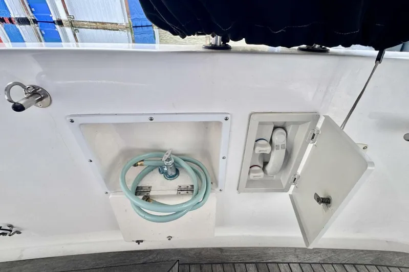  Yacht Photos Pics 1998 Ocean Alexander 420 yacht deck with hose and faucet compartments.