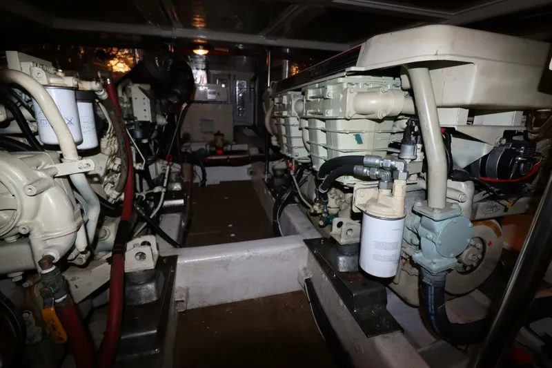  Yacht Photos Pics Engine room of a 1998 Ocean Alexander 420 yacht, showcasing dual engines and mechanical components.
