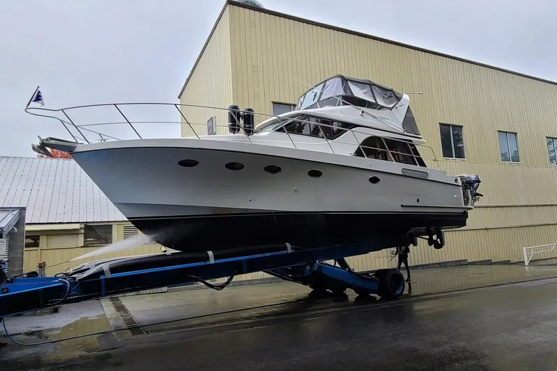  Yacht Photos Pics 1998 Ocean Alexander 420 yacht on trailer near industrial building.
