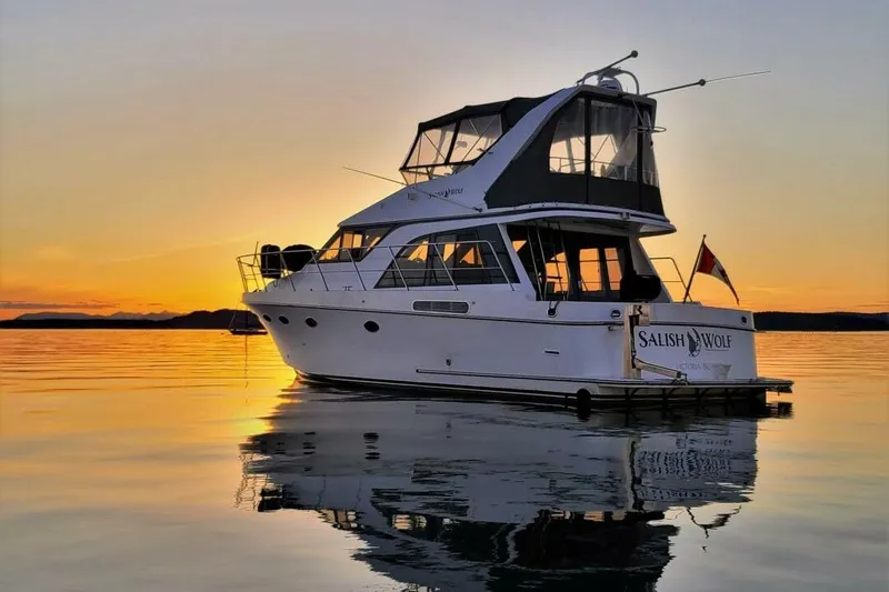  Yacht Photos Pics 1998 Ocean Alexander 420 yacht at sunset, reflecting on calm water.