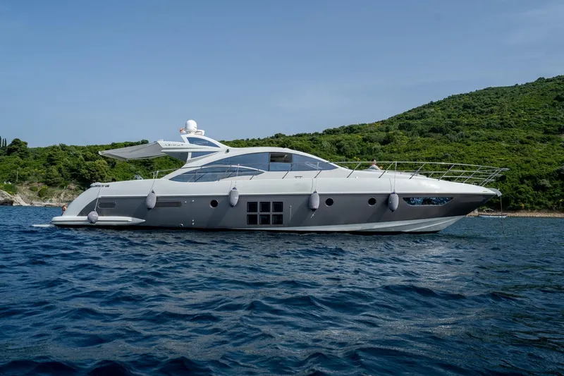 Barba III Yacht Photos Pics Luxurious 2013 Azimut AZ 62S ITALIA yacht cruising on serene waters.