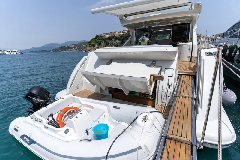 Barba III Yacht Photos Pics 2013 Azimut AZ 62S ITALIA yacht with tender docked in scenic marina.