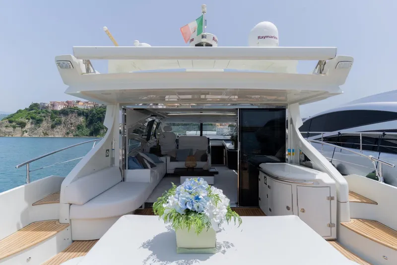 Barba III Yacht Photos Pics Luxurious 2013 Azimut AZ 62S ITALIA yacht with elegant deck and scenic coastal view.
