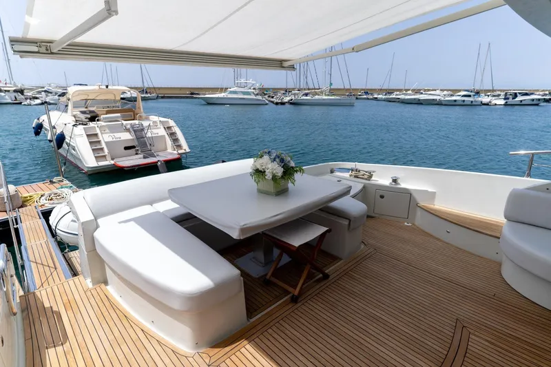 Barba III Yacht Photos Pics Luxurious 2013 Azimut AZ 62S ITALIA yacht with elegant deck seating and marina view.