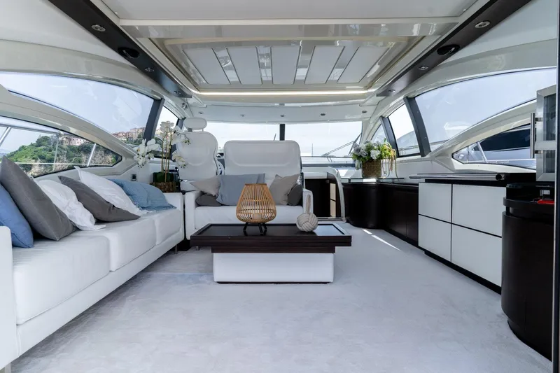 Barba III Yacht Photos Pics Luxurious interior of 2013 Azimut AZ 62S ITALIA yacht with modern furnishings and panoramic windows.