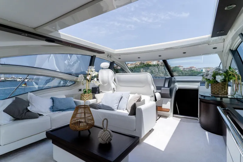 Barba III Yacht Photos Pics Luxurious interior of 2013 Azimut AZ 62S ITALIA yacht with elegant seating and panoramic views.