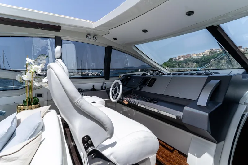 Barba III Yacht Photos Pics Luxurious 2013 Azimut AZ 62S ITALIA yacht interior with modern helm and elegant seating.