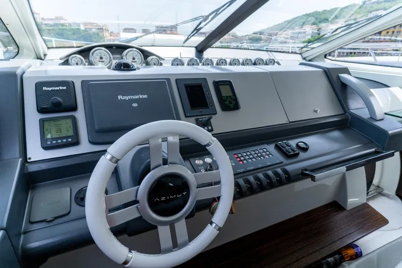 Barba III Yacht Photos Pics Control panel of 2013 Azimut AZ 62S ITALIA yacht with Raymarine navigation system.