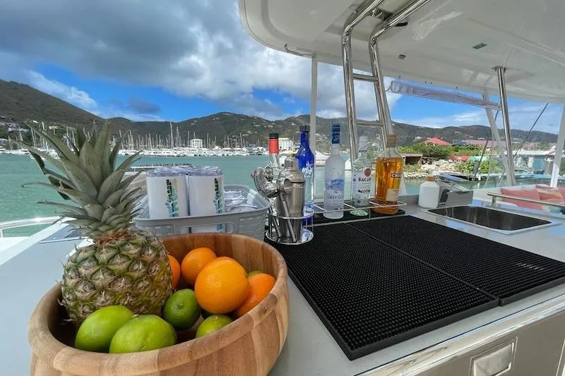 Ruby One Yacht Photos Pics Luxury yacht bar with fruit and drinks, Leopard 58, 2020 model, scenic marina view.