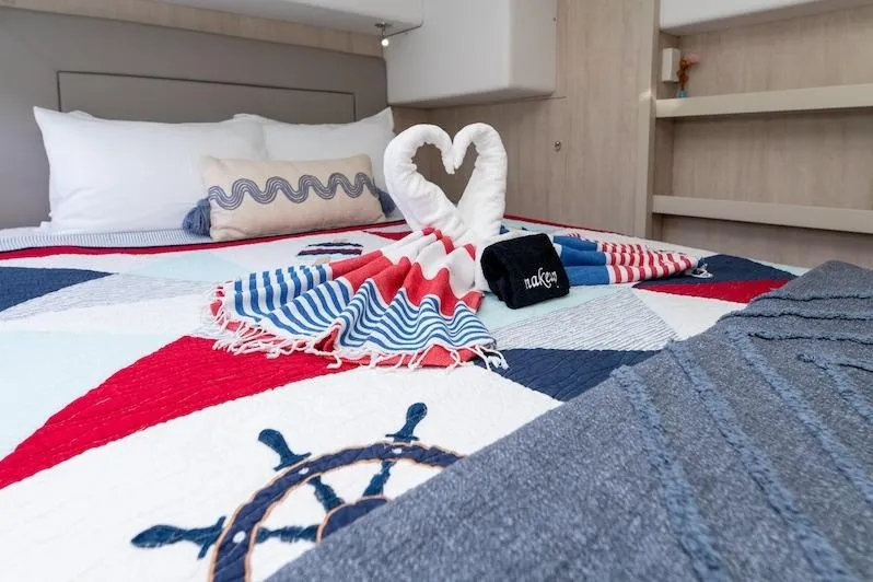Ruby One Yacht Photos Pics Nautical-themed bedroom in 2020 Leopard 58 yacht with heart-shaped towel decor.