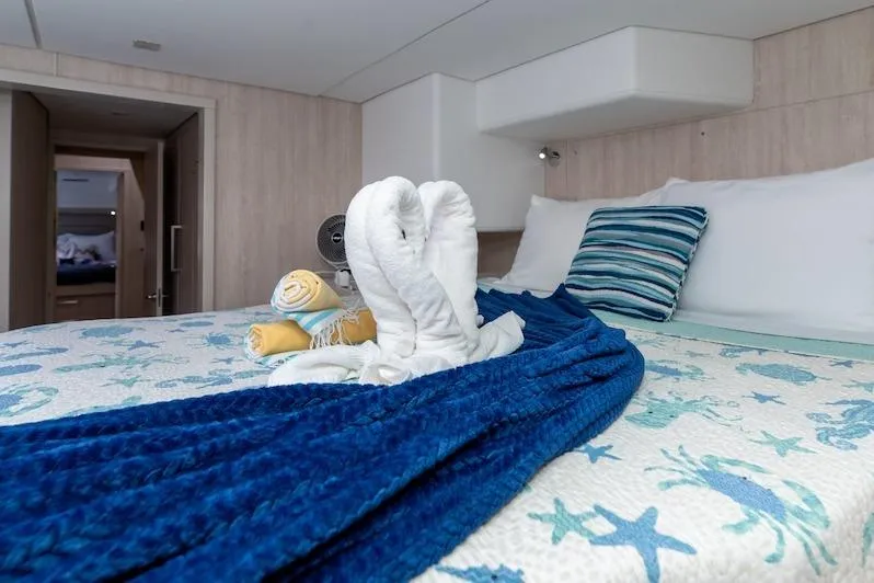 Ruby One Yacht Photos Pics Luxurious Leopard 58 yacht bedroom with elegant decor and towel swans, 2020 model.