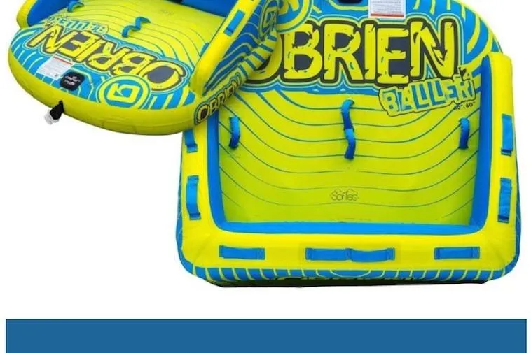 Ruby One Yacht Photos Pics Inflatable water tube with vibrant blue and yellow design, featuring "O'Brien Baller" branding.