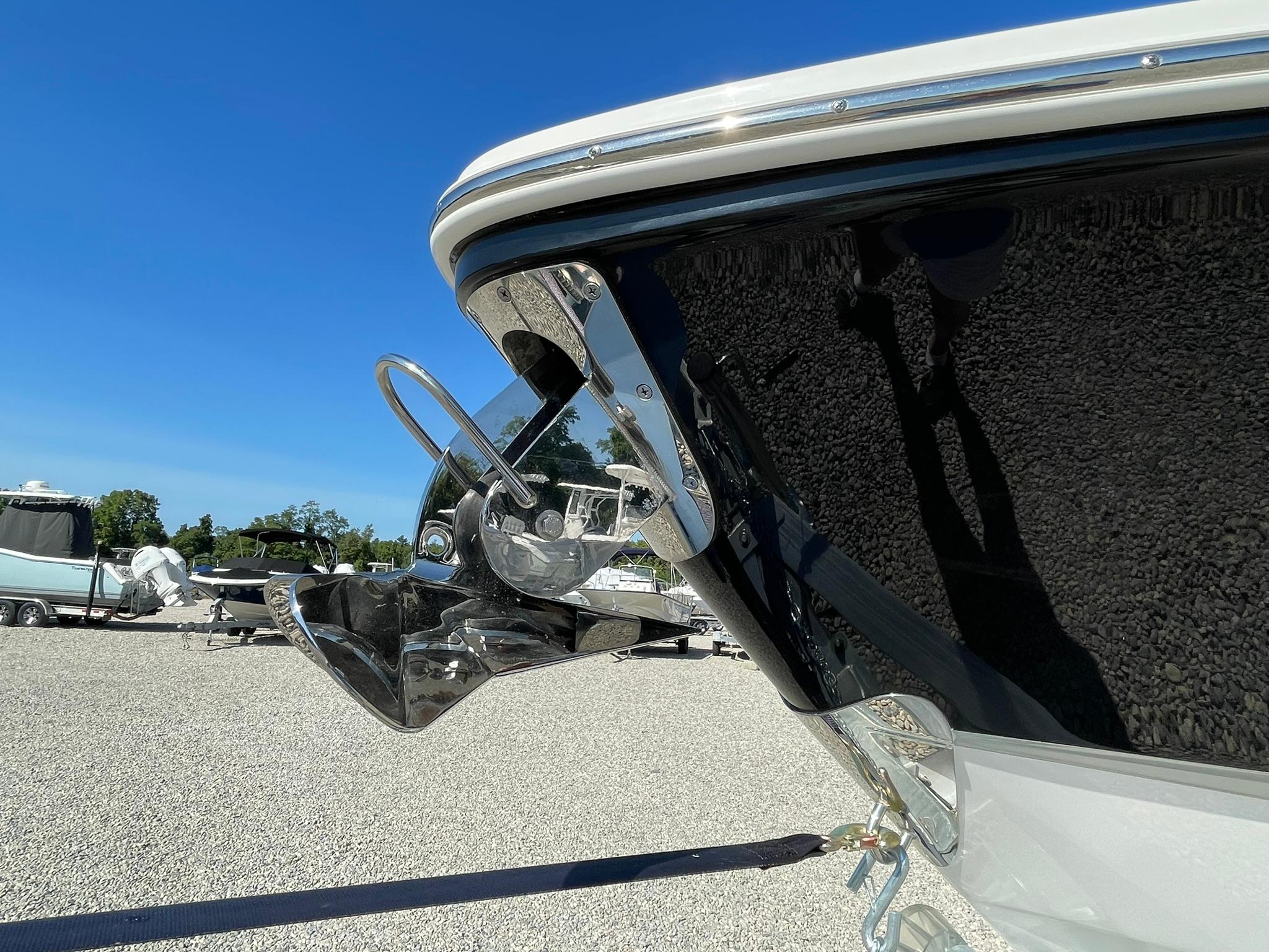 2025 Chaparral 270 OSX boat anchor detail against clear blue sky.