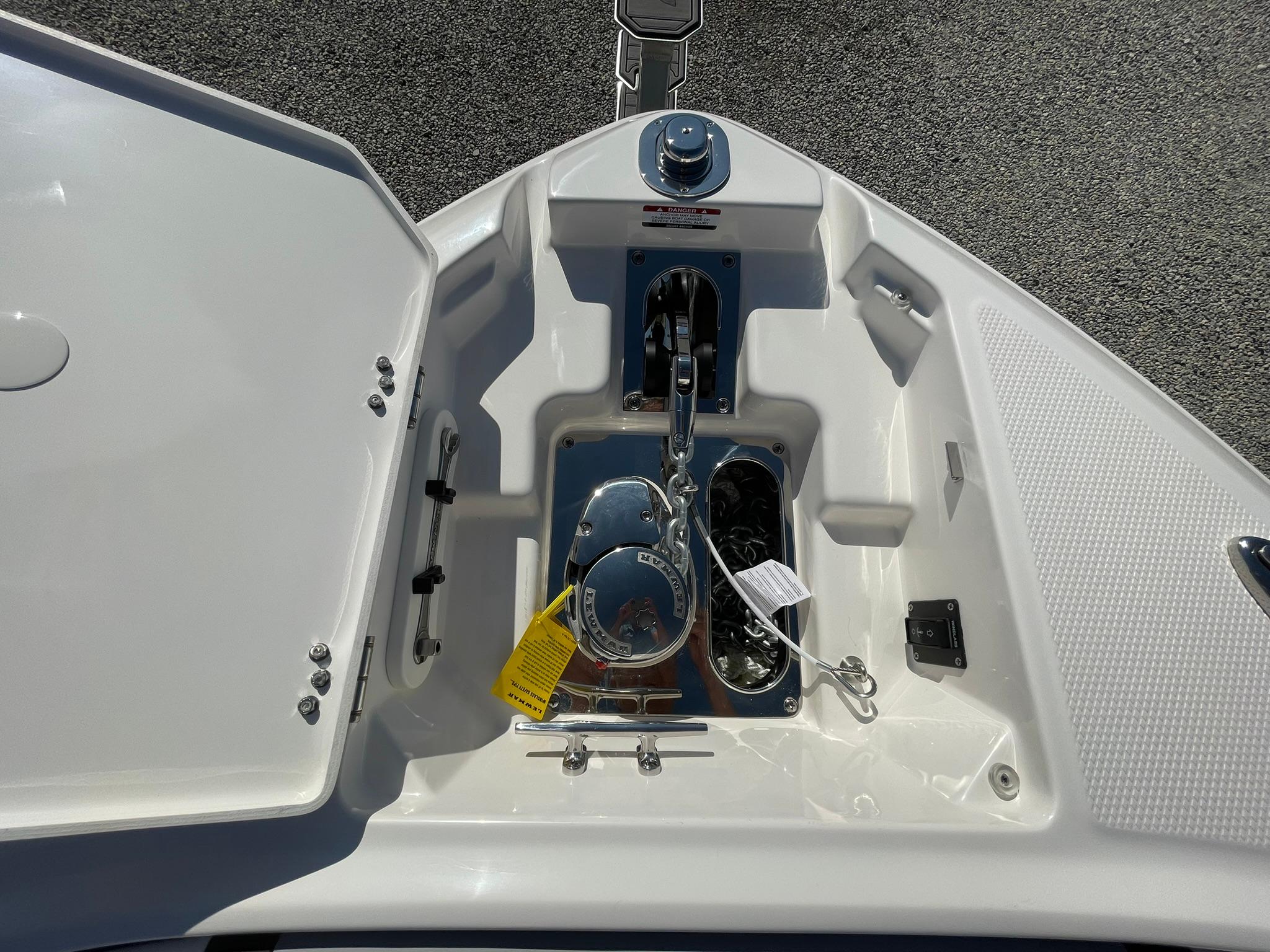 Anchor compartment of 2025 Chaparral 270 OSX boat, featuring storage and winch.