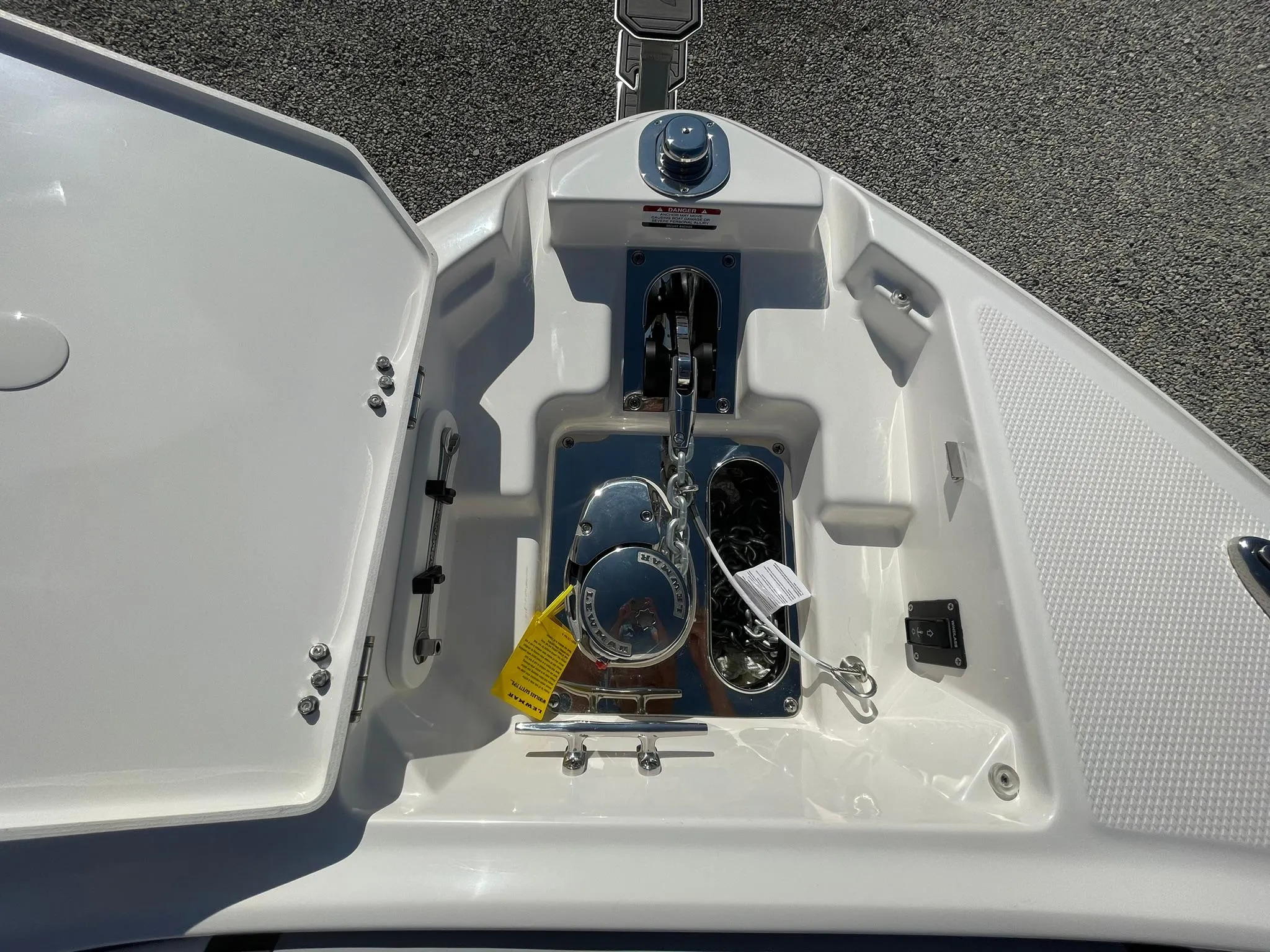 Anchor compartment of 2025 Chaparral 270 OSX boat, featuring storage and winch.