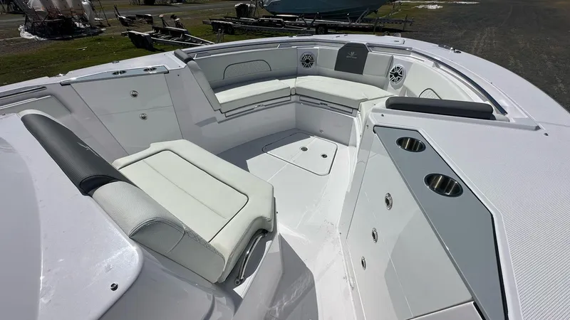  Yacht Photos Pics 2025 Bertram 34 CC boat interior with white seating and cup holders.
