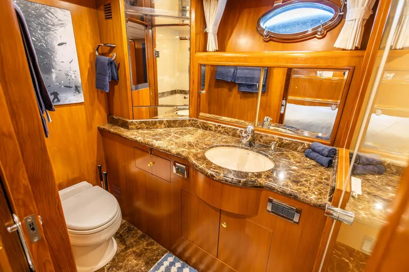 Bluewater Yacht Photos Pics Luxurious bathroom in 2005 Ocean Alexander Raised Pilothouse Flybridge Sedan with marble countertop.