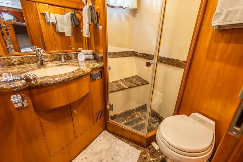 Bluewater Yacht Photos Pics Luxurious bathroom in 2005 Ocean Alexander Raised Pilothouse Flybridge Sedan yacht.