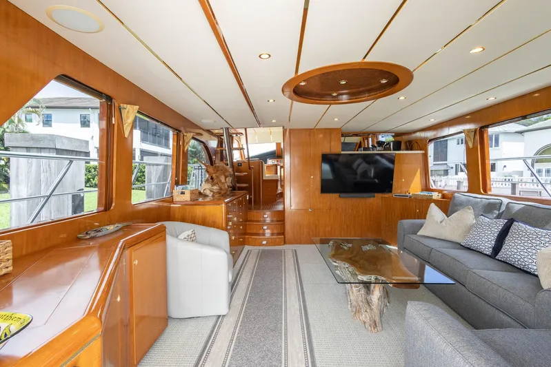 Bluewater Yacht Photos Pics Luxurious 2005 Ocean Alexander Raised Pilothouse Flybridge Sedan interior with elegant wood finishes.