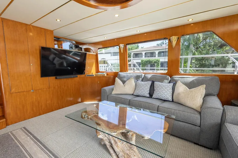 Bluewater Yacht Photos Pics Luxurious 2005 Ocean Alexander Raised Pilothouse Flybridge Sedan interior with plush seating and modern decor.