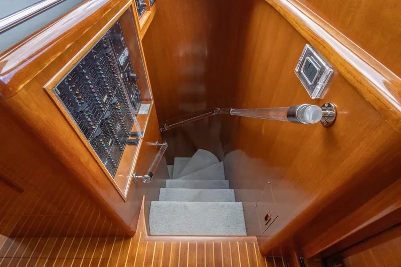 Bluewater Yacht Photos Pics Staircase with control panel on 2005 Ocean Alexander Raised Pilothouse Flybridge Sedan yacht.