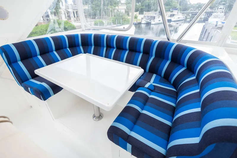 Bluewater Yacht Photos Pics Luxurious blue-striped seating area on 2005 Ocean Alexander yacht.