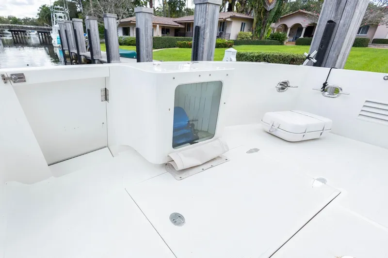 Bluewater Yacht Photos Pics 2005 Ocean Alexander Raised Pilothouse Flybridge Sedan deck with storage and seating area.