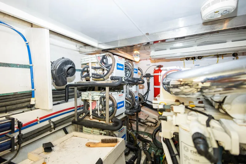 Bluewater Yacht Photos Pics Engine room of 2005 Ocean Alexander Raised Pilothouse Flybridge Sedan, featuring mechanical equipment and piping.