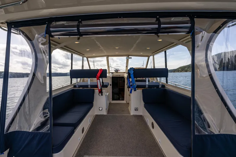 Misty Yacht Photos Pics Interior view of 2007 Mainship Pilot 34 boat with seating and life jackets.