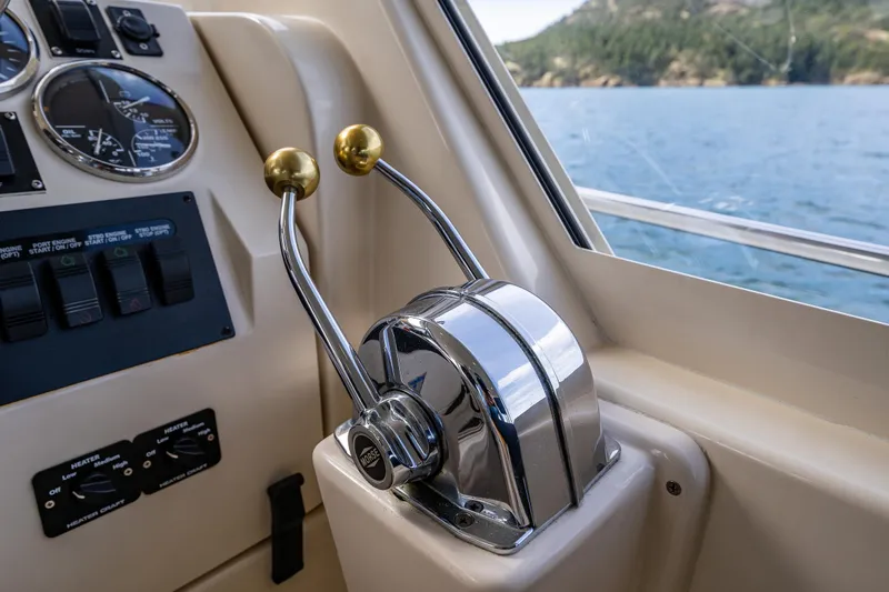 Misty Yacht Photos Pics 2007 Mainship Pilot 34 helm controls with ocean view through window.