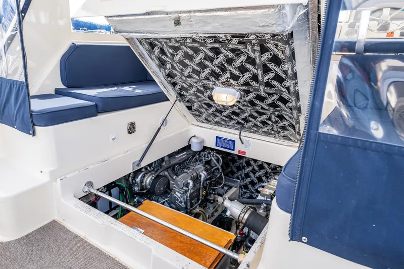 Misty Yacht Photos Pics Engine compartment of a 2007 Mainship Pilot 34 boat, showcasing detailed mechanical components.
