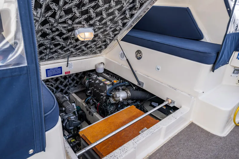 Misty Yacht Photos Pics Engine compartment of a 2007 Mainship Pilot 34 boat, showcasing mechanical components.