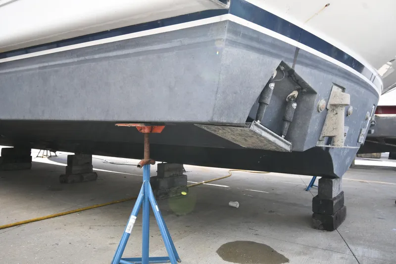 Surfin The Net Yacht Photos Pics 2001 Ferretti Yachts 72 on dry dock, supported by stands and blocks.