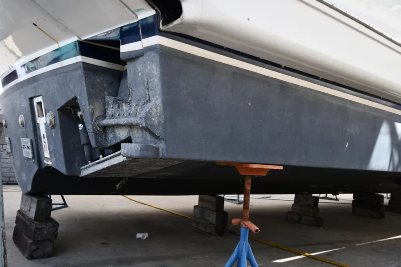 Surfin The Net Yacht Photos Pics 2001 Ferretti Yachts 72 on dry dock, showing hull and propeller details.