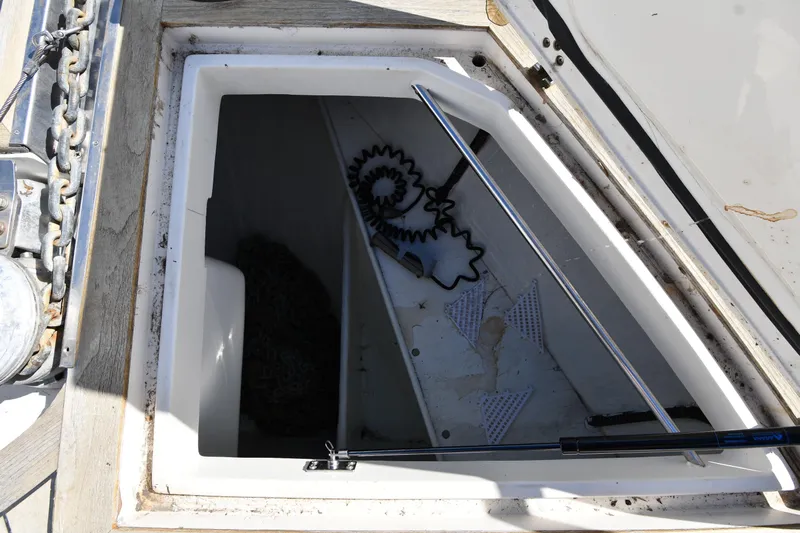 Surfin The Net Yacht Photos Pics Open storage compartment on 2001 Ferretti Yachts 72, showing interior details and equipment.