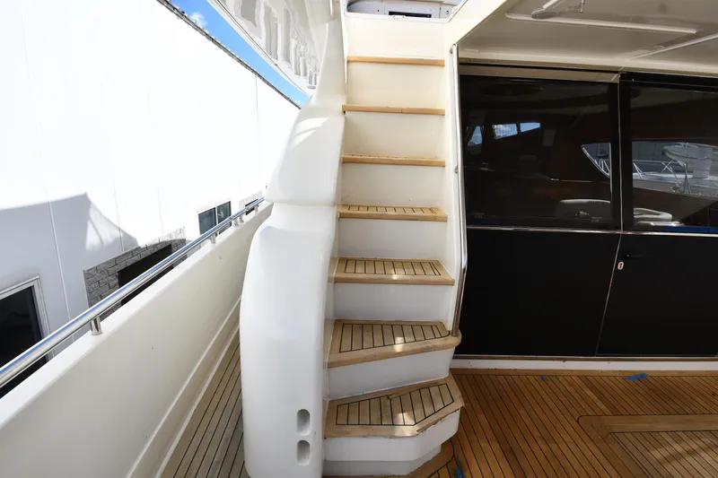 Surfin The Net Yacht Photos Pics Staircase on 2001 Ferretti Yachts 72, featuring teak steps and sleek design.