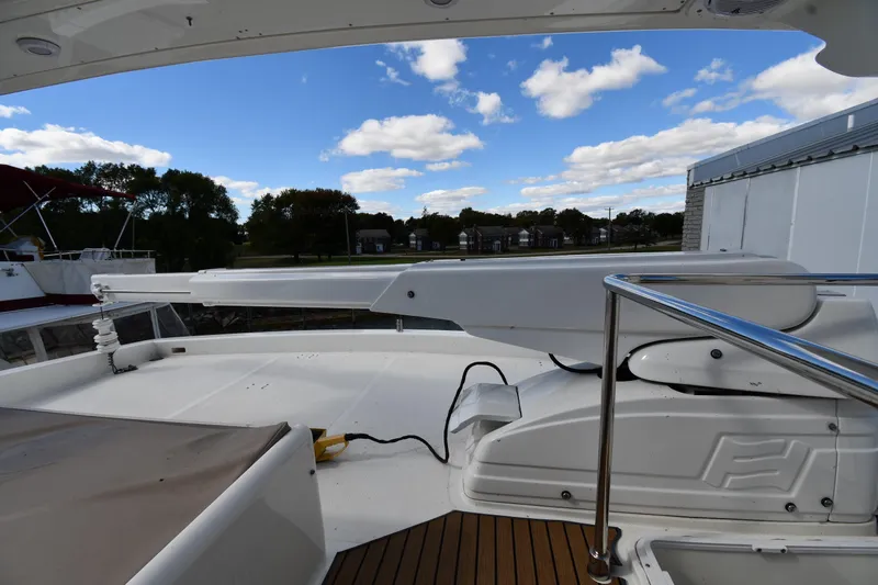Surfin The Net Yacht Photos Pics Deck view of 2001 Ferretti Yachts 72 under a partly cloudy sky.