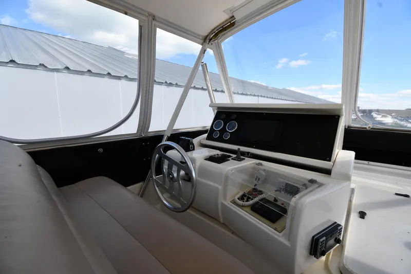 Surfin The Net Yacht Photos Pics Helm of 2001 Ferretti Yachts 72 with steering wheel and control panel.