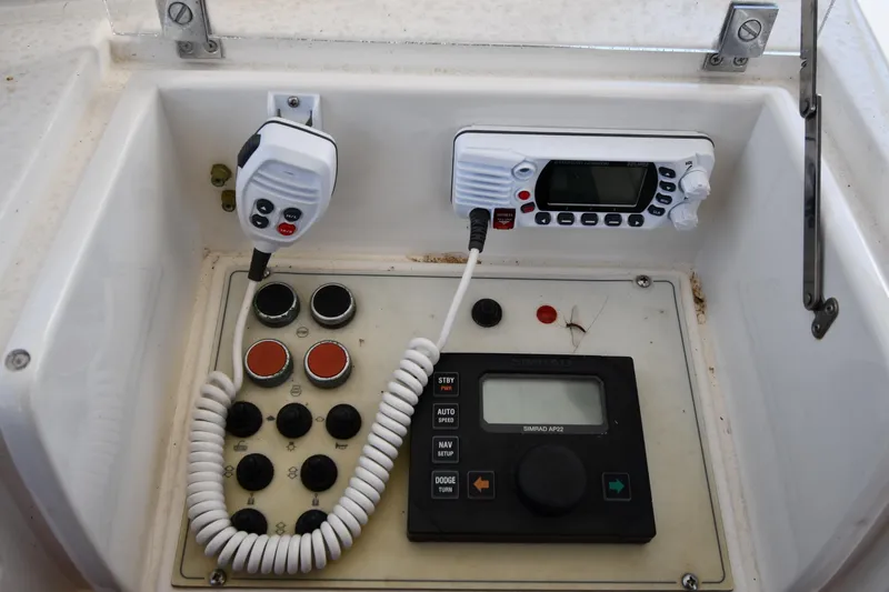 Surfin The Net Yacht Photos Pics Control panel of a 2001 Ferretti Yachts 72, featuring communication and navigation equipment.