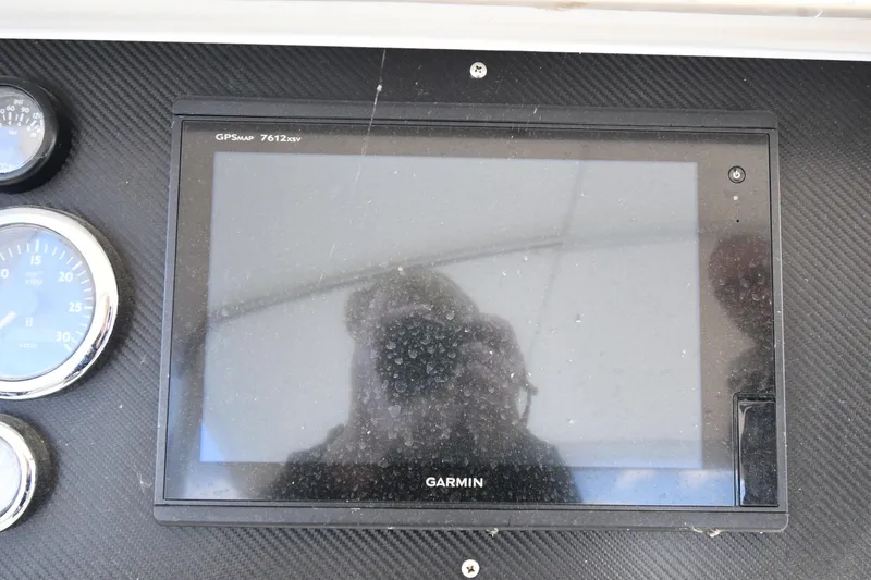 Surfin The Net Yacht Photos Pics Garmin GPS display on 2001 Ferretti Yachts 72 dashboard with gauges.