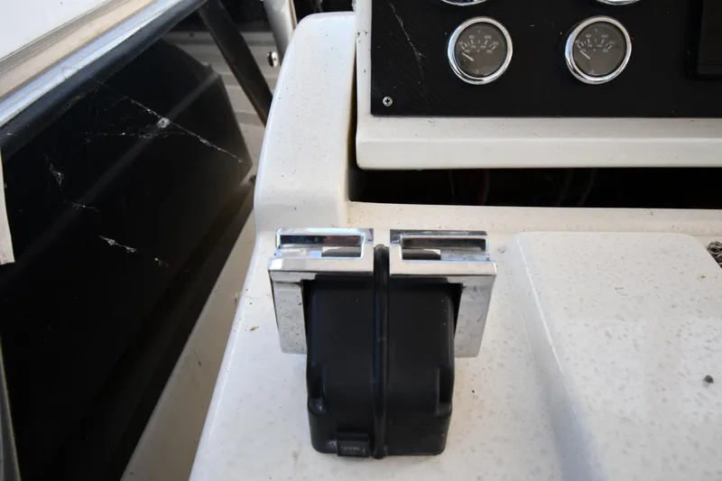 Surfin The Net Yacht Photos Pics Control panel of a 2001 Ferretti Yachts 72, featuring throttle levers and gauges.