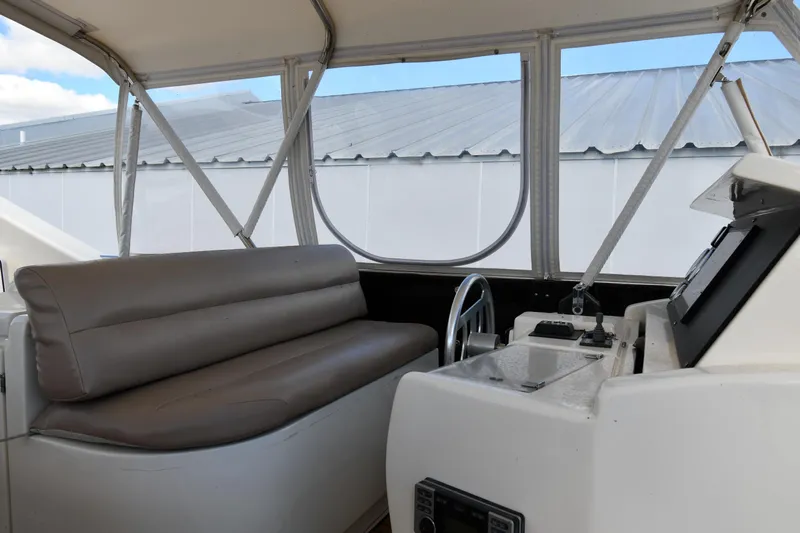 Surfin The Net Yacht Photos Pics Interior view of 2001 Ferretti Yachts 72 helm with seating and controls.