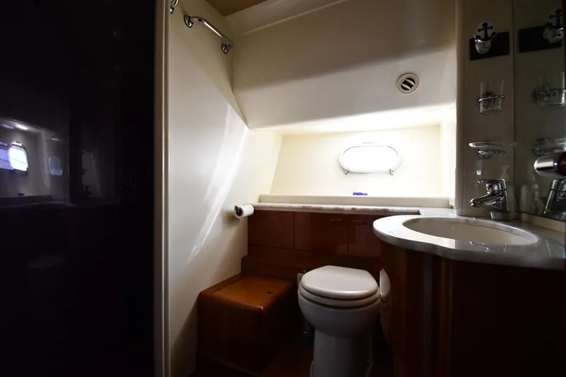 Surfin The Net Yacht Photos Pics Luxurious bathroom in 2001 Ferretti Yachts 72, featuring modern fixtures and natural light.