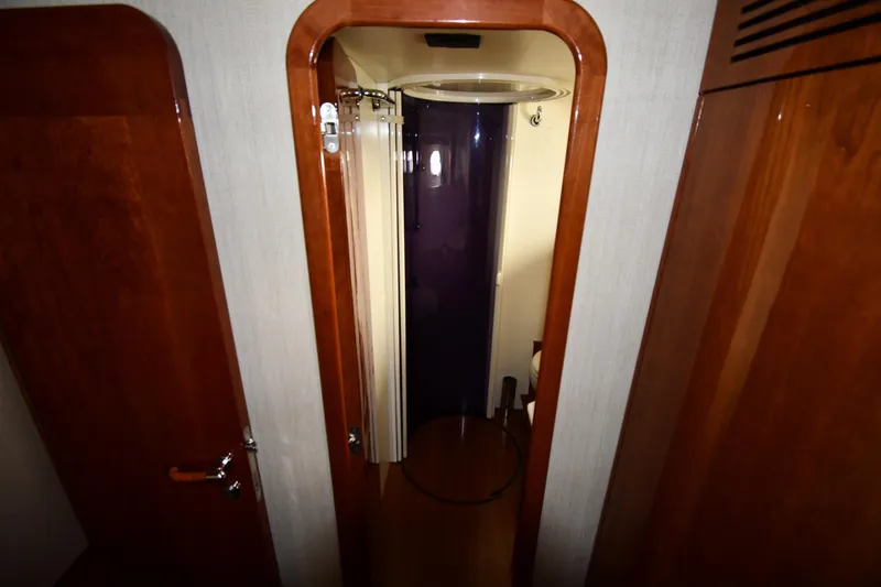 Surfin The Net Yacht Photos Pics Interior view of 2001 Ferretti Yachts 72, featuring a compact shower area.