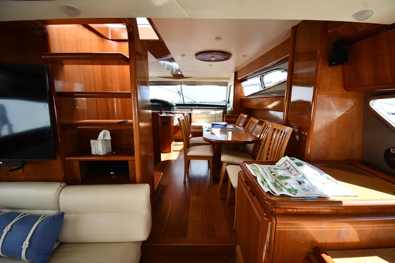 Surfin The Net Yacht Photos Pics Luxurious interior of 2001 Ferretti Yachts 72 with elegant wood finishes and comfortable seating.